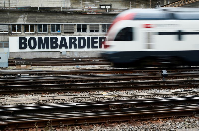 FILE PHOTO: A Bombardier advertising board is pictured in front of a SBB CFF Swiss railway