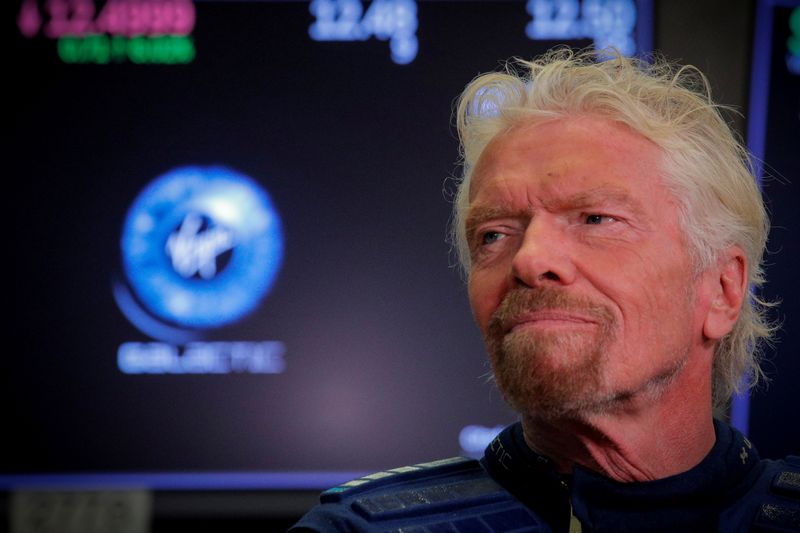 FILE PHOTO: Sir Richard Branson stands on floor of the NYSE  as Virgin Galactic (SPCE) begins