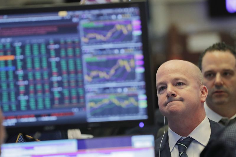 The day's numbers are reflected above the floor of the New York Stock Exchange shortly before