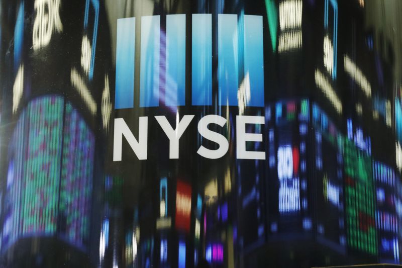 The day's numbers are reflected above the floor of the New York Stock Exchange shortly before