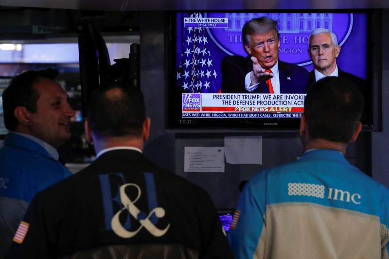 Traders work on the floor of the NYSE in New York