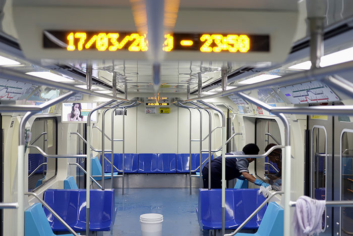 A cleaner works on the disinfection of a subway train as a measure against the coronavirus