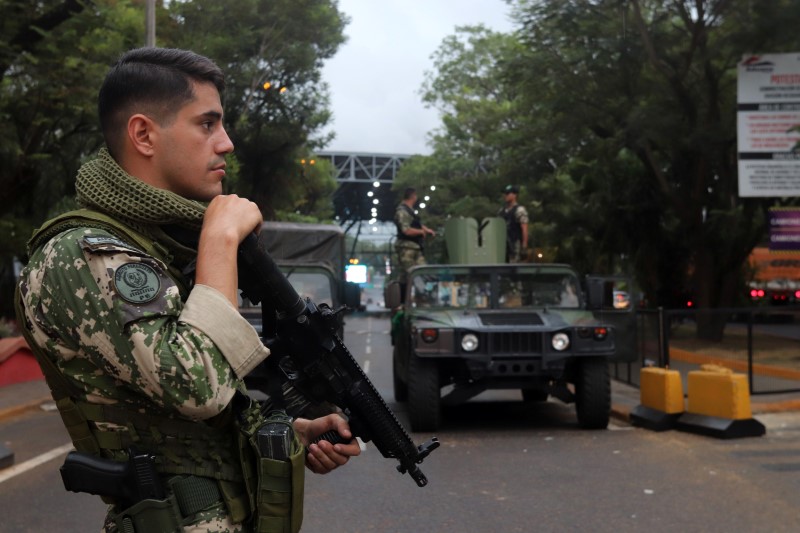 Paraguayan soldiers patrol the Friendship Bridge that connects Ciudad del Este in Paraguay with