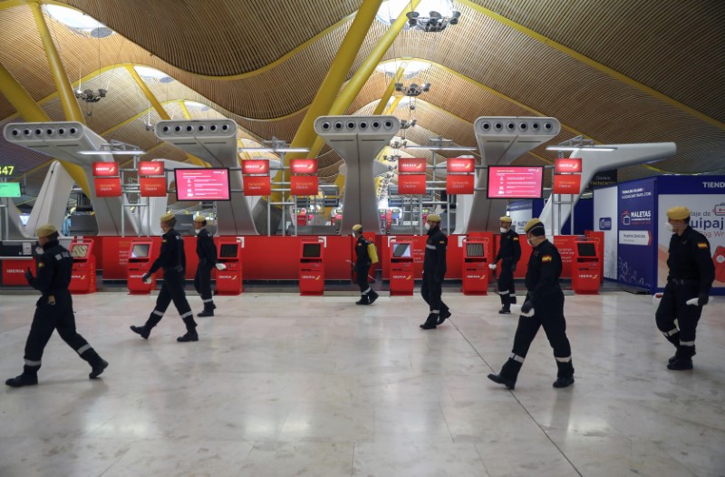 Military Emergency Unit members disinfect Madrid?s Adolfo Suarez Barajas Airport in Madrid