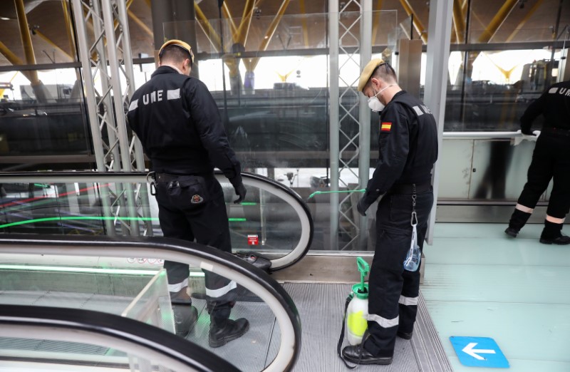 Military Emergency Unit members disinfect Madrid?s Adolfo Suarez Barajas Airport in Madrid