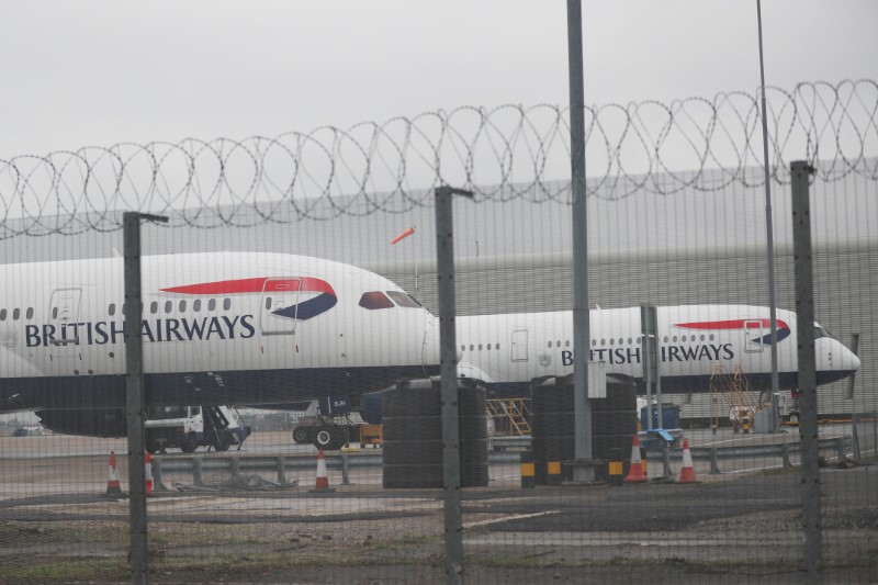 Parked British Airways planes are seen at Heathrow Airport in London