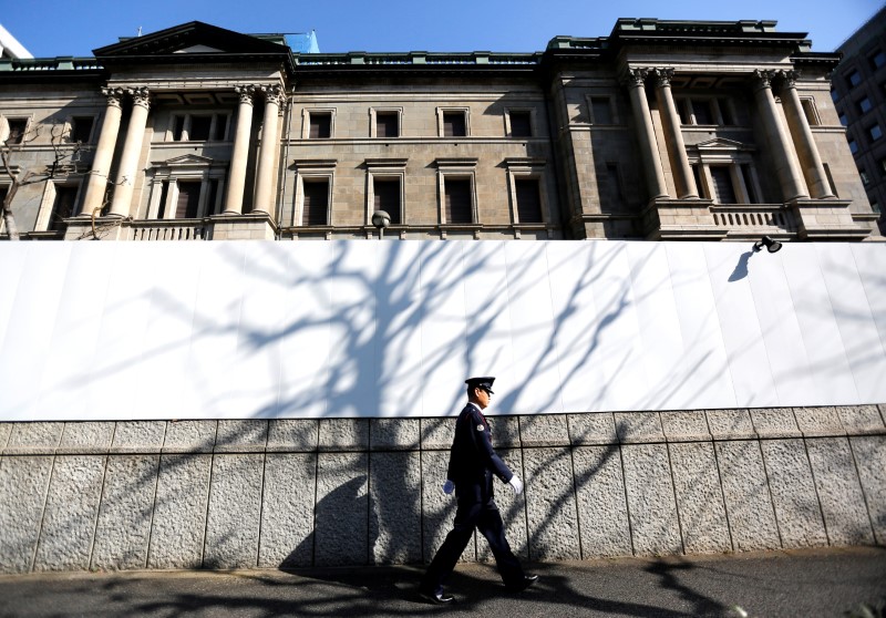 FILE PHOTO: Specialists work on a crane in front of the European Central Bank (ECB) in