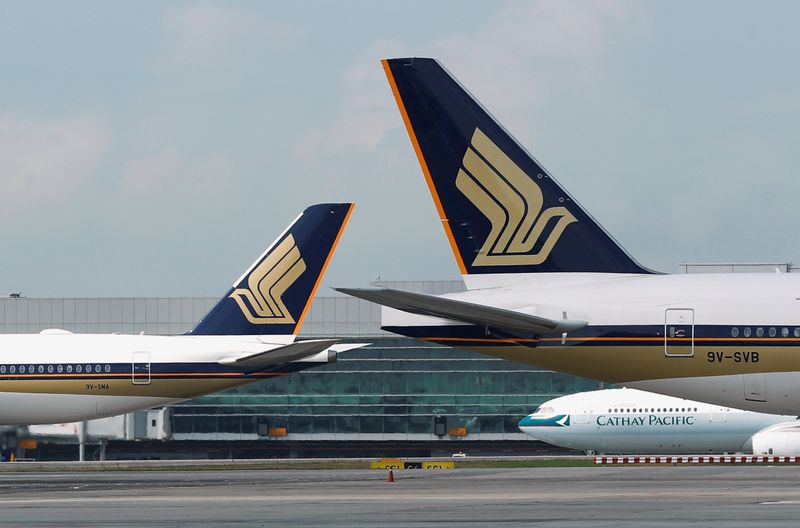 FILE PHOTO: Singapore Airlines planes are pictured on the tarmac at Changi Airport, Singapore