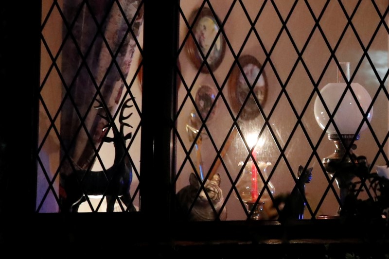 A candle is seen in the window of a house in Milton Keynes.