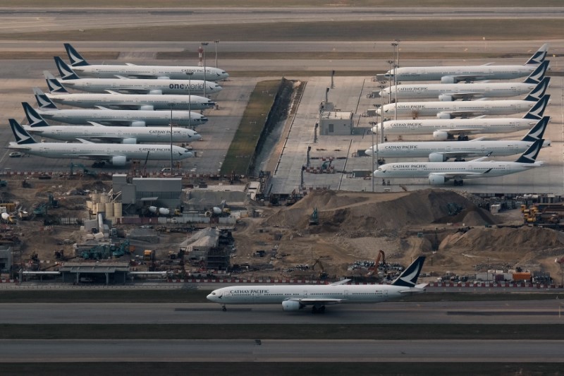 FILE PHOTO: Airplanes of German carrier Lufthansa are parked on the tarmac as air traffic is