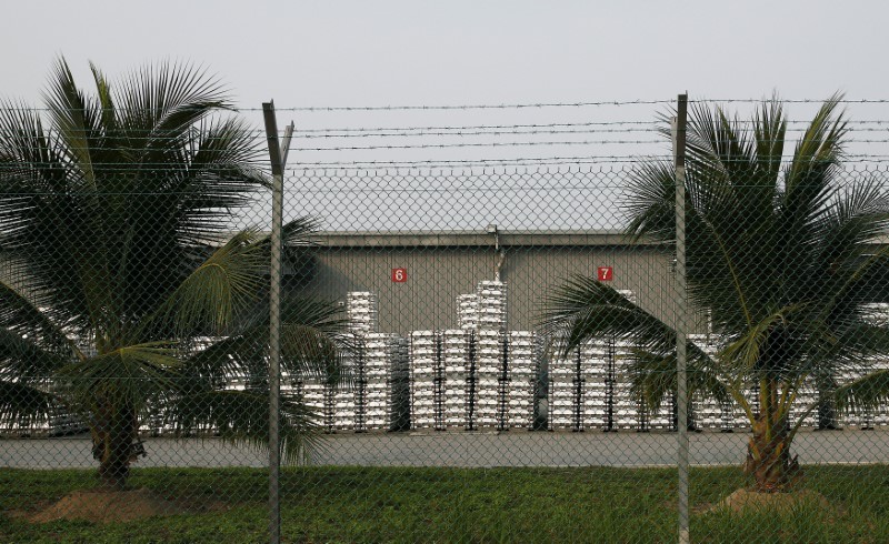 FILE PHOTO: Aluminium ingots are seen outside a warehouse that stores London Metal Exchange