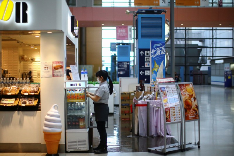 A vendor, wearing protective mask following an outbreak of the coronavirus disease (COVID-19),