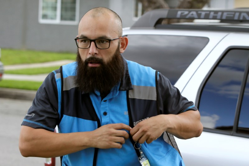 Joseph Alvarado in the driver seat as he makes deliveries for Amazon during the outbreak of the