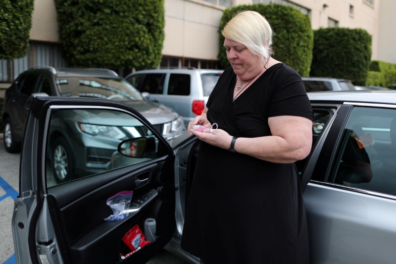 FILE PHOTO: Uber and Lyft driver Tammie Jean Lane, 60, who had part of her lung removed after