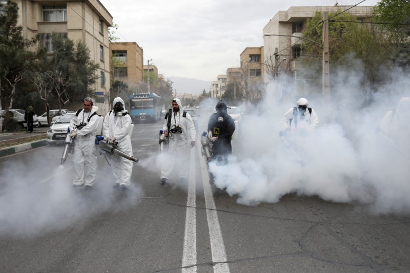 FILE PHOTO: Members of firefighters wear protective face masks, amid fear of coronavirus