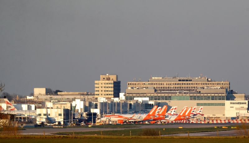 FILE PHOTO: Easyjet and British Airways planes are pictured at Gatwick airport