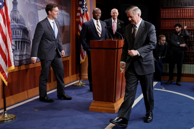 Republican Senators discuss the coronavirus relief bill ahead of a vote on Capitol Hill in