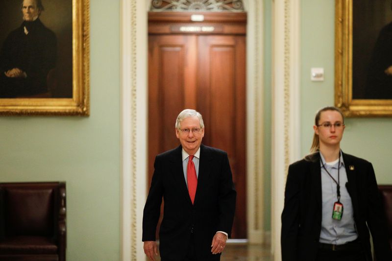U.S. Senate Majority Leader McConnell enters the Senate Chamber Floor after Congress agreed to