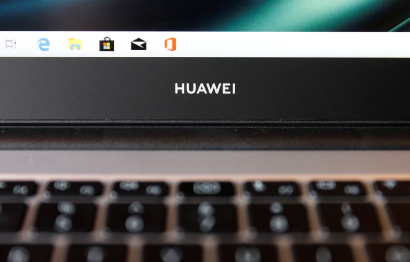 FILE PHOTO: A Huawei logo is seen on a device at a media event in London