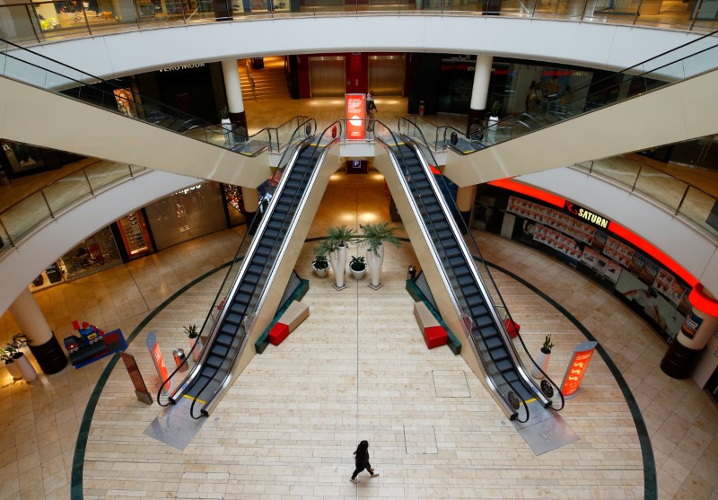 FILE PHOTO: A person is seen inside an empty shopping mall during a partial lockdown in