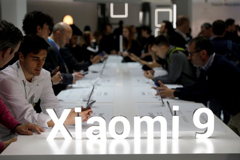 Visitors visit the Xiaomi booth at the Mobile World Congress in Barcelona