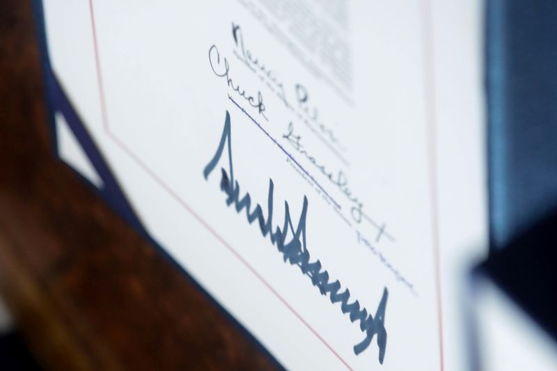 FILE PHOTO: U.S. President Trump hosts coronavirus aid bill signing ceremony at the White House