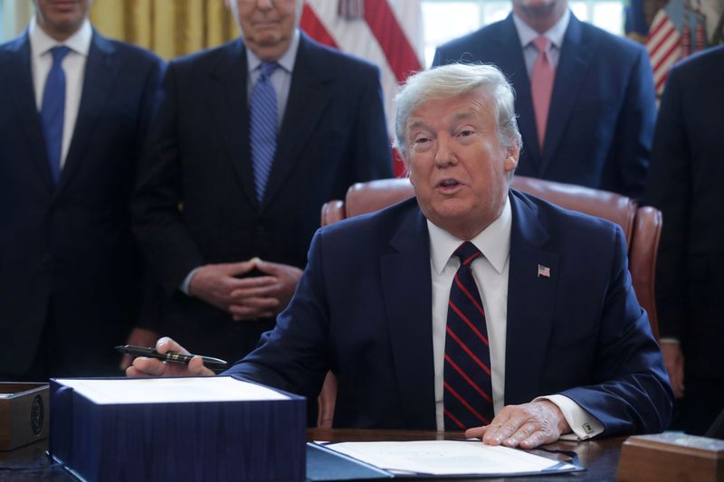 FILE PHOTO: U.S. President Trump hosts coronavirus aid bill signing ceremony at the White House