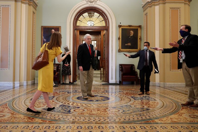 Senate Majority Leader McConnell speaks to members of the news media after departing from the