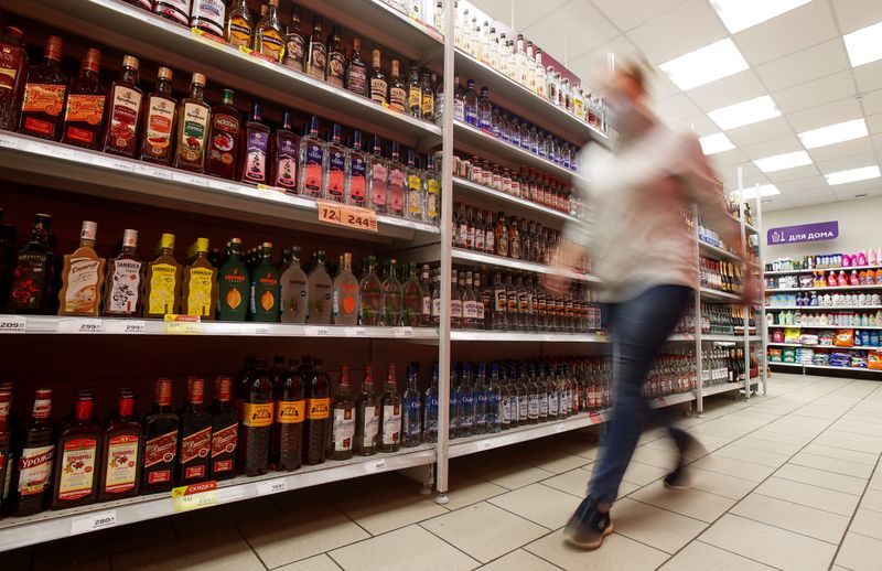 Bottles of alcohol are displayed for sale in a supermarket in Moscow