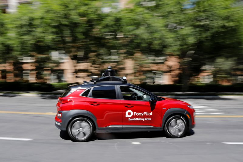 Autonomous electric vehicles deliver packages during the outbreak of the coronavirus disease