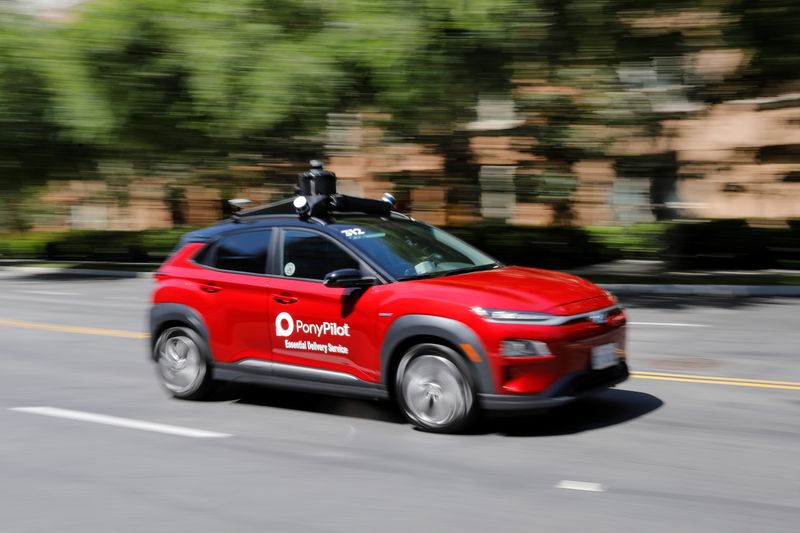 Autonomous electric vehicles deliver packages during the outbreak of the coronavirus disease