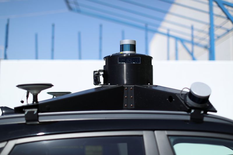 Autonomous electric vehicles deliver packages during the outbreak of the coronavirus disease
