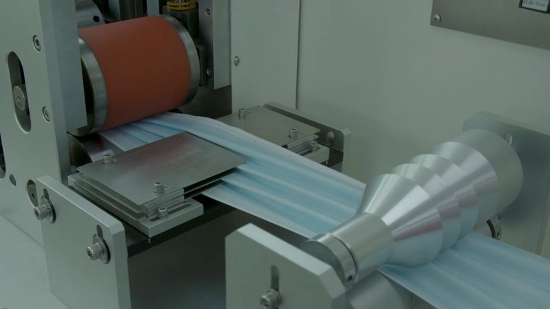 Still image from video of Razer's face mask production line in Singapore