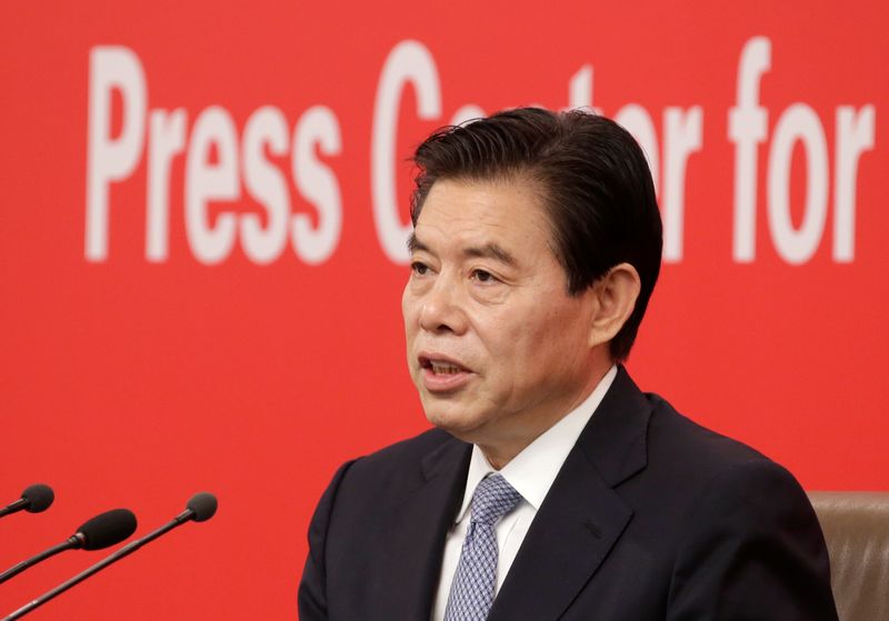 Chinese Commerce Minister Zhong Shan  attends a news conference in Beijing