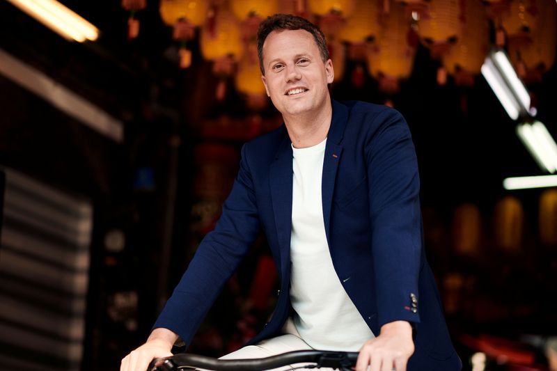 Ties Carlier, co-founder of Dutch electric bike maker Vanmoof, is seen on a bike