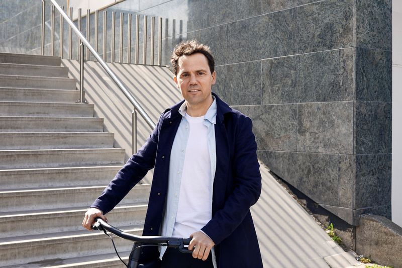 Taco Carlier, co-founder of Dutch electric bike maker Vanmoof, is seen on a bike