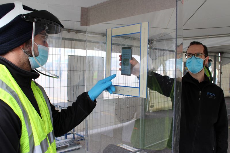 An entrance at FCA's Warren Stamping Plant is marked with yellow tape and stanchions to help