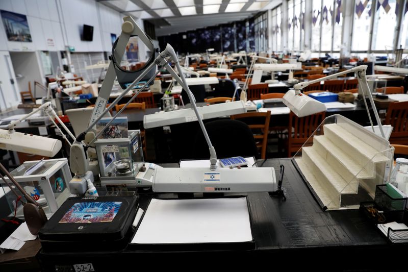 A general view shows empty trading tables at the diamond exchange floor, which remains shut due