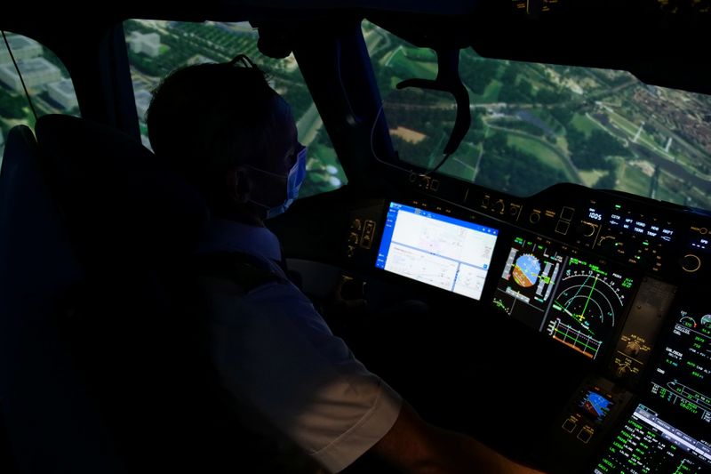 Air France pilot trains in a flight simulator at a training centre near Paris amid COVID-19
