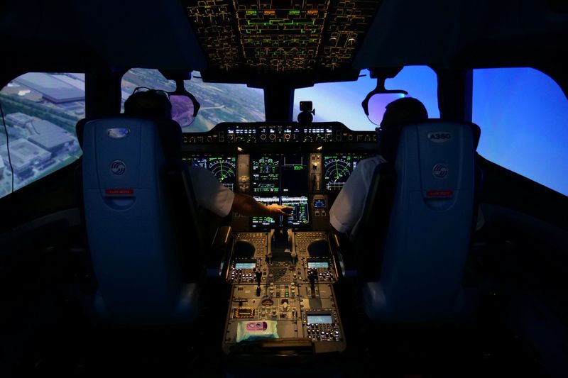 Air France pilots train in a flight simulator at a training centre near Paris amid COVID-19