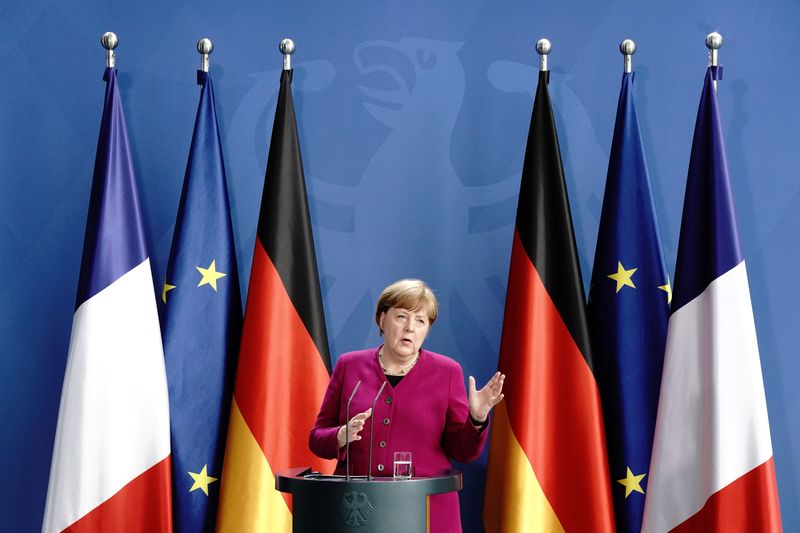 German Chancellor Angela Merkel holds a joint video news conference with French President