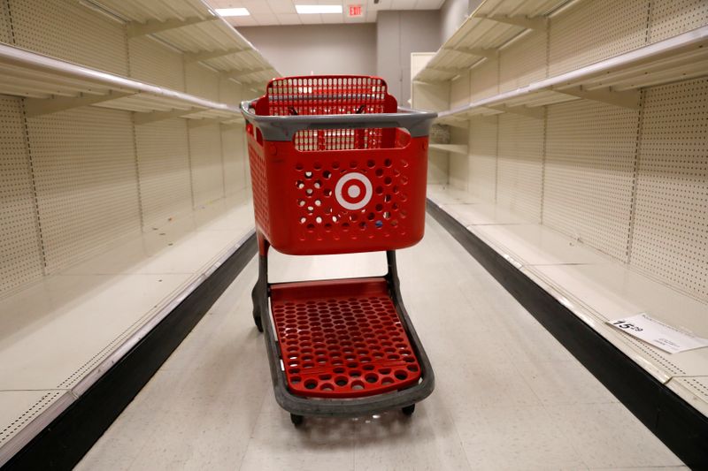 FILE PHOTO: A shopping cart sits in an aisle empty of cleaning products at Target store during