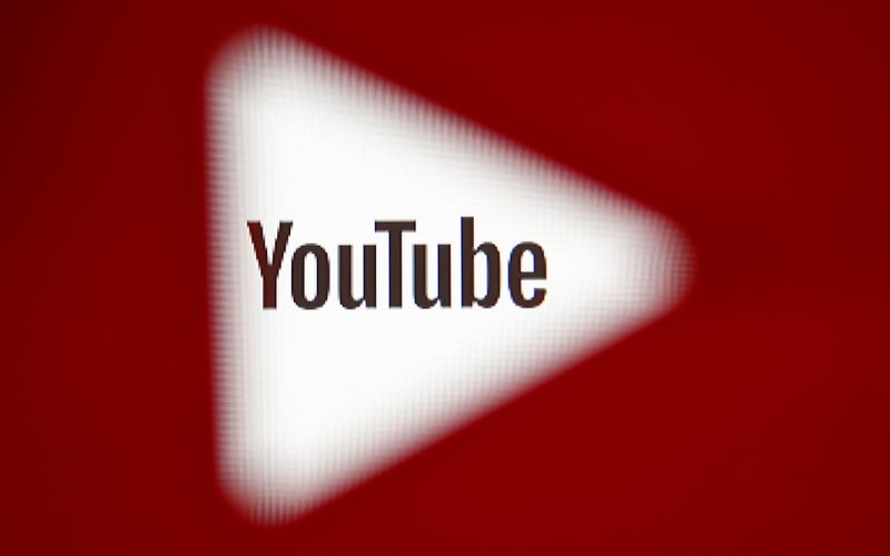 FILE PHOTO: A 3D-printed YouTube icon is seen in front of a displayed YouTube logo in this