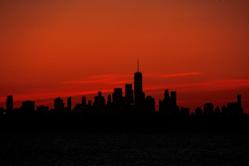 One World Trade Center and the lower Manhattan skyline are seen shortly after sunset from the