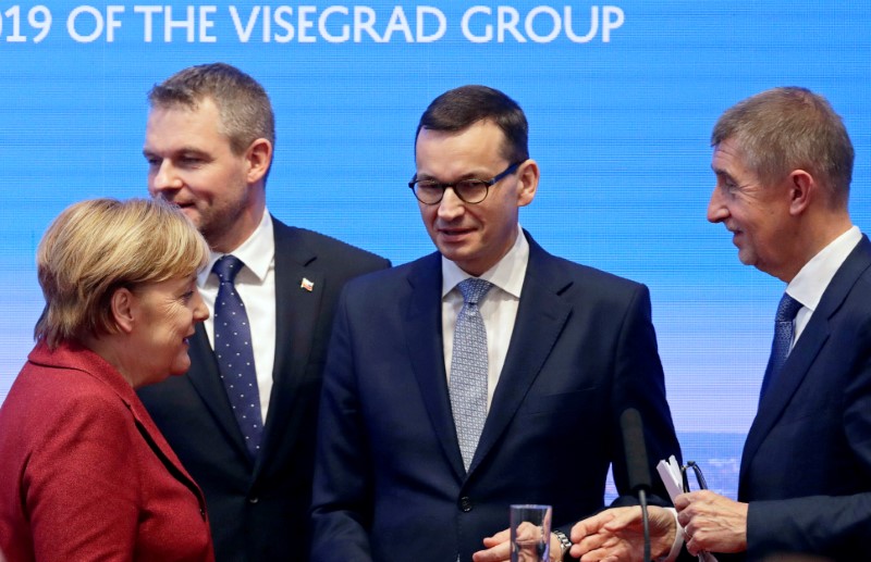 FILE PHOTO: German Chancellor Angela Merkel, Slovak PM Pellegrini, Polish PM Morawiecki and