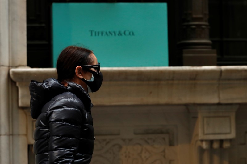 FILE PHOTO: A man passes by the closed Tiffany & Co store on Wall St. in the financial district