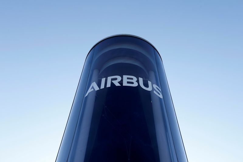 FILE PHOTO: Water vapour billows from smokestacks at a factory in Colomiers, near Toulouse