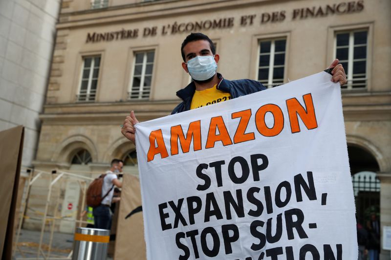 Climate activists attend a demonstration against Amazon near the Bercy Finance Ministry in