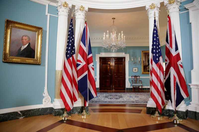 The flags of the United States and the United Kingdom stand after bi-lateral photo between U.S.