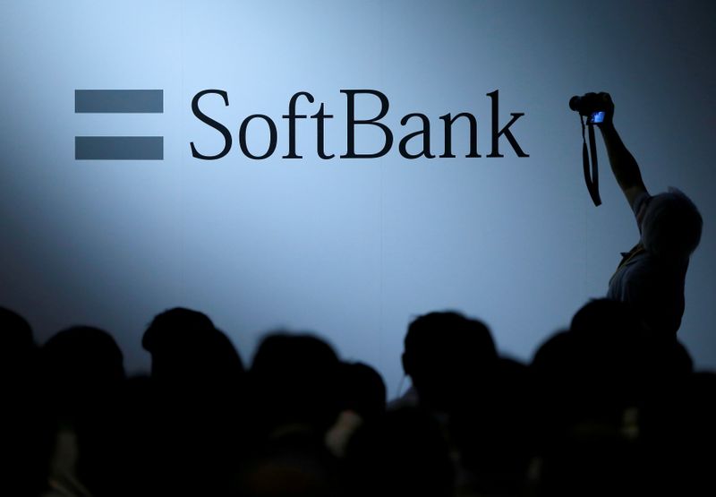 FILE PHOTO: The logo of SoftBank Group Corp is displayed at the SoftBank World 2017 conference